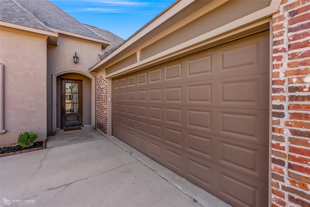 doorway to property featuring a garage