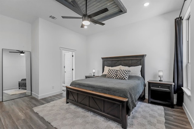 bedroom with dark hardwood / wood-style floors and ceiling fan