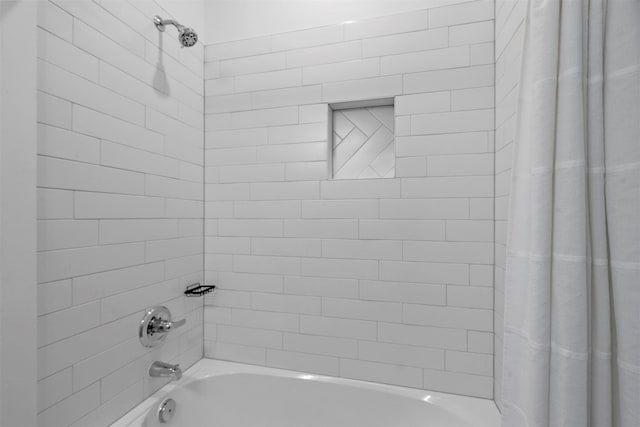 bathroom featuring shower / bath combo with shower curtain