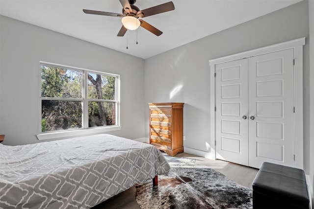 bedroom featuring a closet, ceiling fan, and hardwood / wood-style flooring