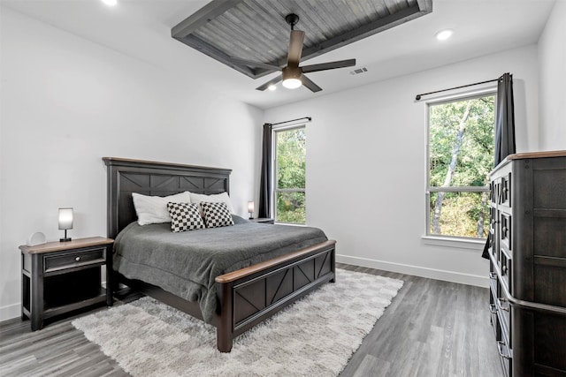 bedroom with ceiling fan and hardwood / wood-style flooring