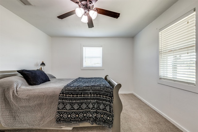 bedroom with light carpet and ceiling fan