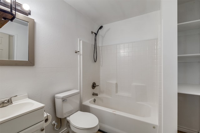 full bathroom with vanity, toilet, and shower / tub combination