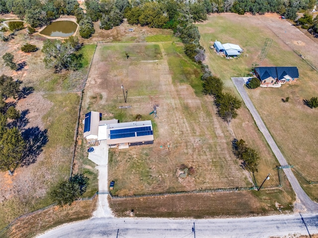 birds eye view of property featuring a water view and a rural view