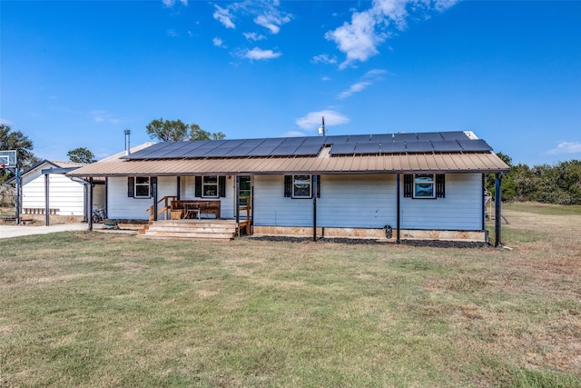 view of front of house featuring solar panels, covered porch, and a front lawn