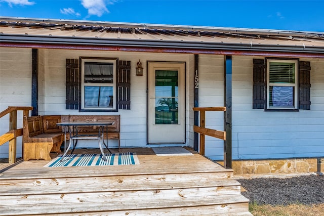 doorway to property featuring a porch