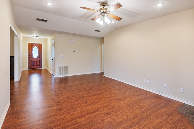 entrance foyer with ceiling fan, vaulted ceiling, and dark hardwood / wood-style flooring