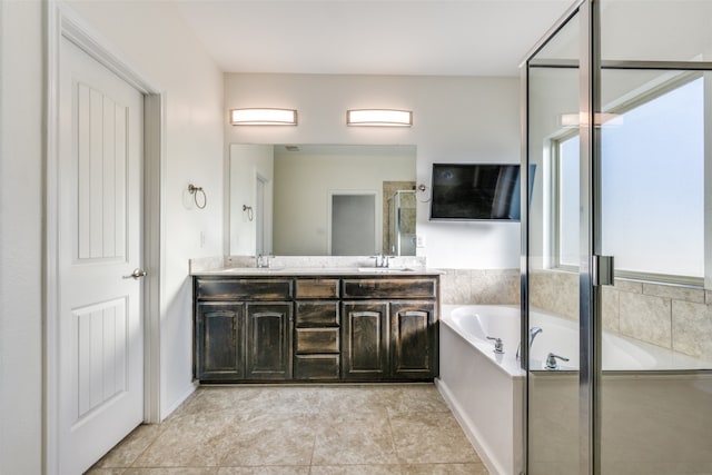 bathroom with vanity, tile patterned floors, and separate shower and tub