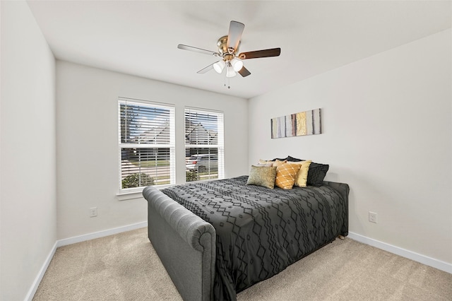 bedroom with light carpet and ceiling fan