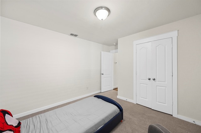 bedroom with a closet and carpet