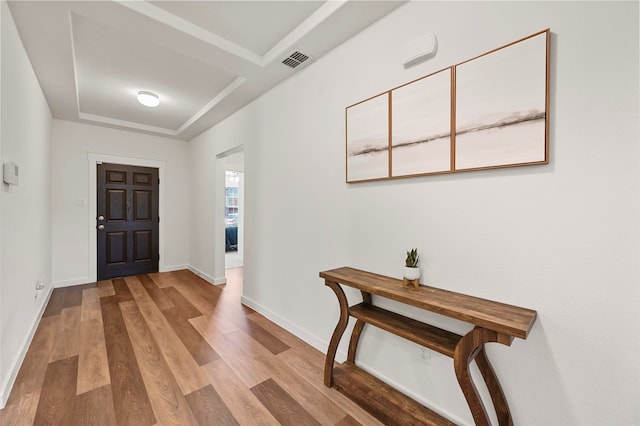 foyer entrance with hardwood / wood-style floors