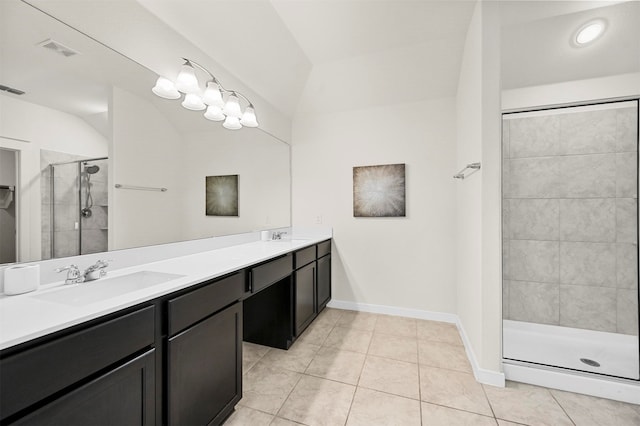 bathroom with a shower with door, tile patterned flooring, and vanity