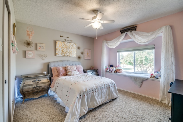 bedroom featuring carpet floors, a textured ceiling, and ceiling fan