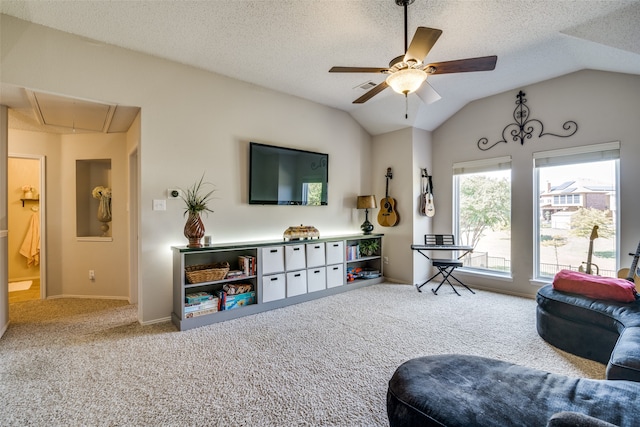 carpeted living room featuring a textured ceiling, ceiling fan, and vaulted ceiling