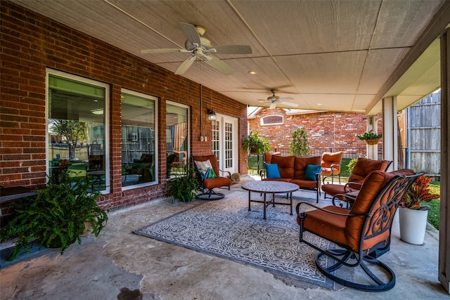 view of patio / terrace featuring french doors, an outdoor living space, and ceiling fan