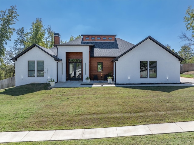 rear view of house with a lawn