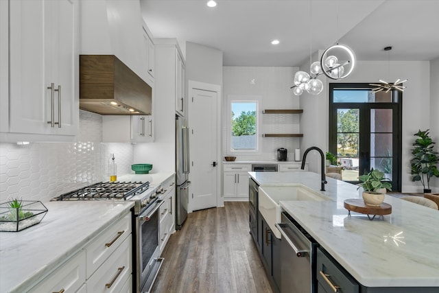 kitchen with appliances with stainless steel finishes and white cabinetry