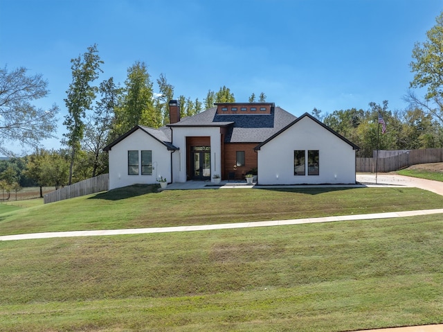 view of front of home with a front lawn