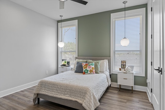 bedroom featuring wood-type flooring and ceiling fan