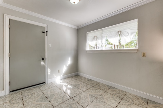 empty room with ornamental molding and light tile patterned floors