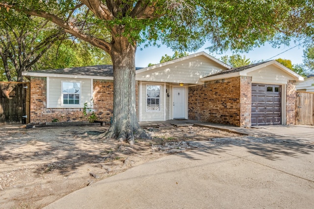 single story home featuring a garage