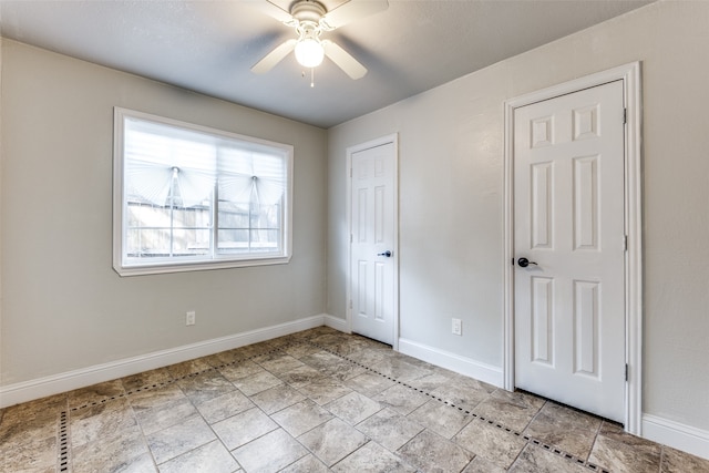 unfurnished bedroom featuring ceiling fan