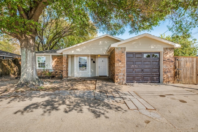 ranch-style house featuring a garage