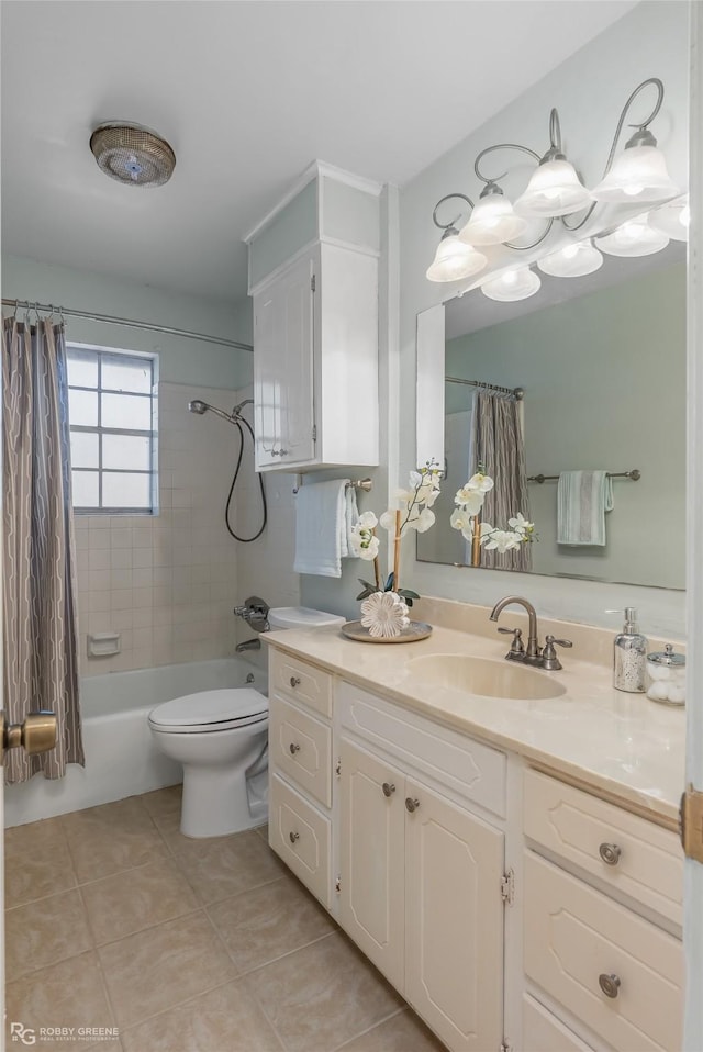 bathroom featuring tile patterned flooring, toilet, vanity, and shower / bath combo