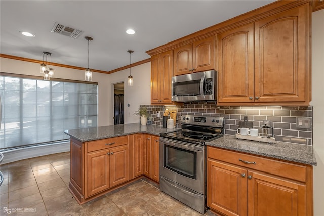 kitchen with visible vents, dark stone countertops, appliances with stainless steel finishes, a peninsula, and crown molding