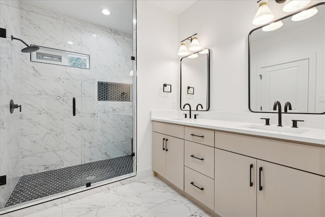 bathroom featuring vanity and a shower with shower door