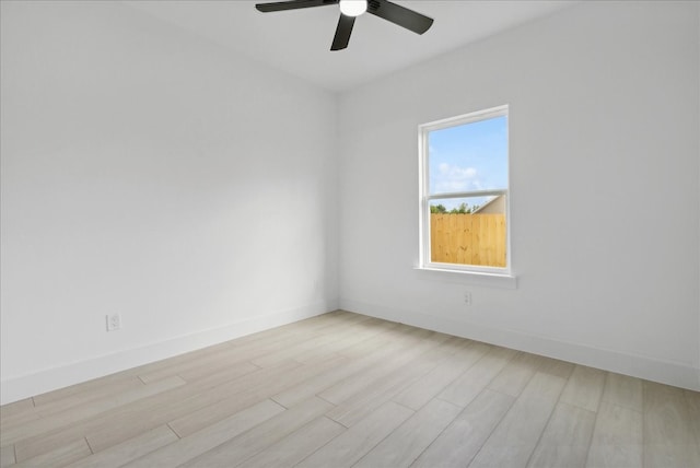 unfurnished room with ceiling fan and light wood-type flooring