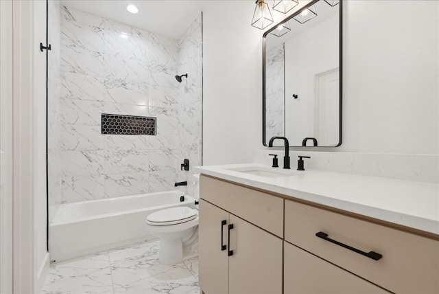 full bathroom featuring vanity, toilet, and tiled shower / bath