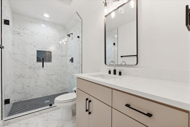 bathroom with toilet, a shower with shower door, and vanity