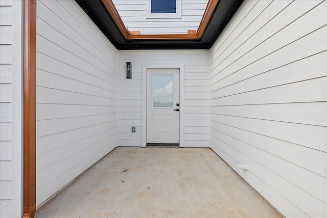 entrance to property featuring a patio area