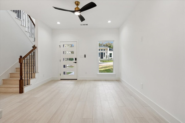 foyer featuring light wood-type flooring and ceiling fan