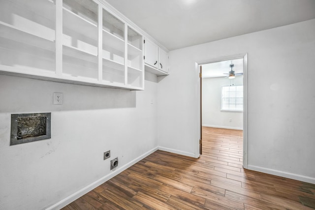 washroom featuring ceiling fan, cabinets, hookup for an electric dryer, and dark hardwood / wood-style floors