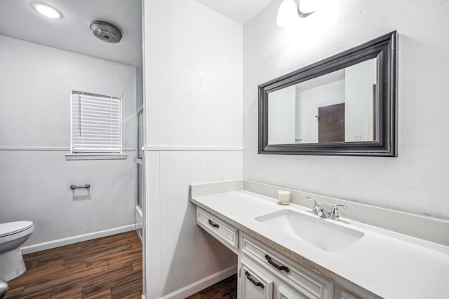 full bathroom with vanity, toilet, bathtub / shower combination, and hardwood / wood-style floors