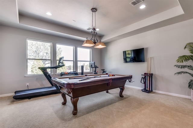 rec room featuring a raised ceiling, light carpet, and pool table