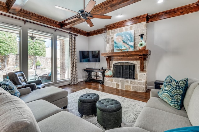 living room with a fireplace, hardwood / wood-style floors, ceiling fan, and beamed ceiling