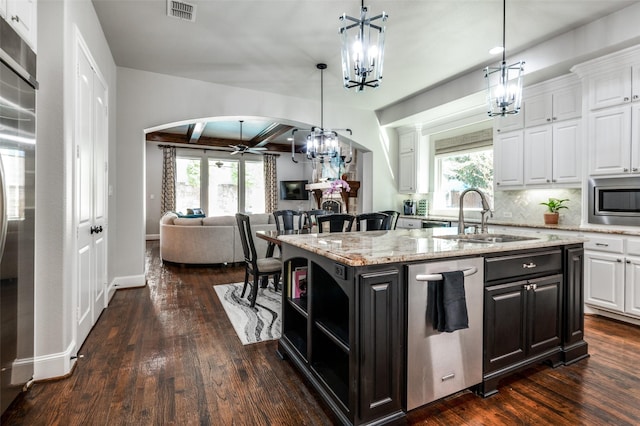 kitchen featuring a center island with sink, ceiling fan, white cabinetry, and sink