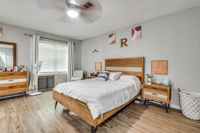 bedroom with ceiling fan and light wood-type flooring