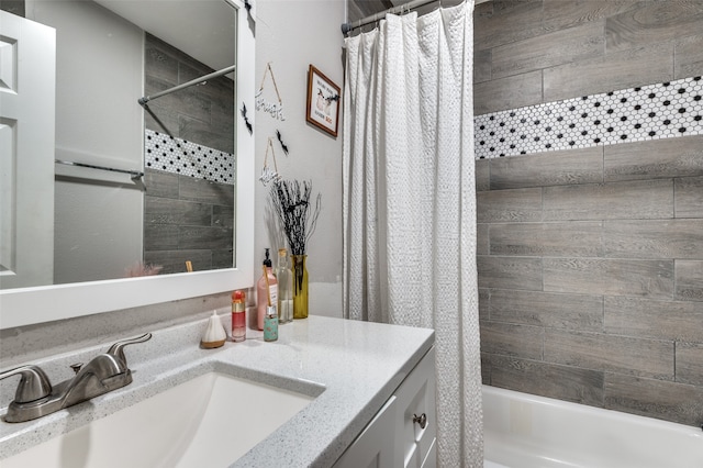 bathroom featuring vanity and shower / tub combo with curtain