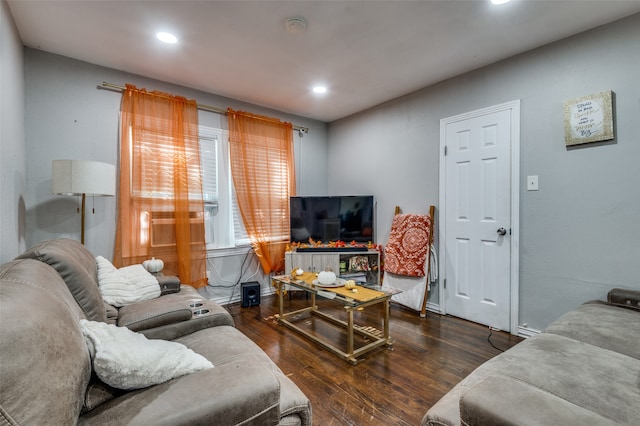 living room with dark hardwood / wood-style flooring