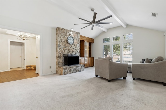 living room with vaulted ceiling with beams, a stone fireplace, ceiling fan with notable chandelier, and light wood-type flooring