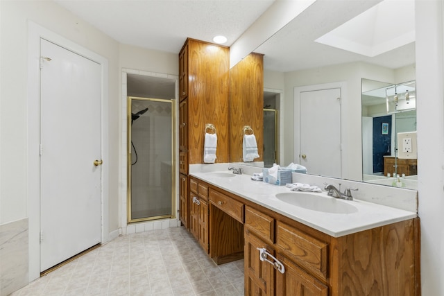 bathroom featuring vanity and a shower with shower door