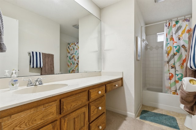 bathroom featuring vanity, shower / bath combo with shower curtain, and tile patterned flooring