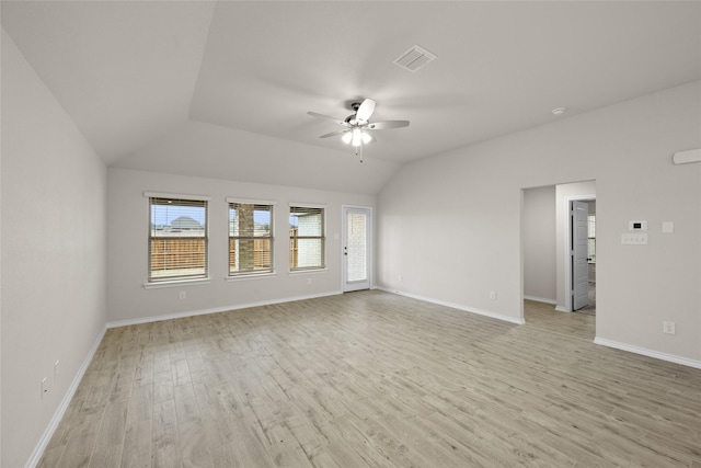 spare room featuring lofted ceiling, ceiling fan, and light hardwood / wood-style flooring