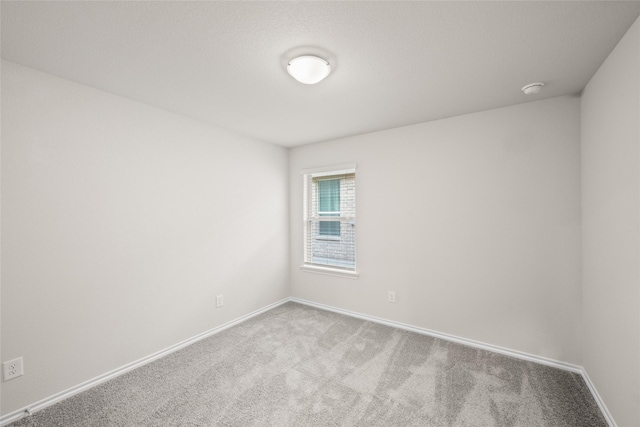 unfurnished room featuring carpet floors