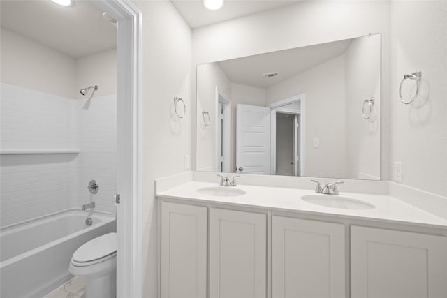 full bathroom with vanity, shower / tub combination, and toilet