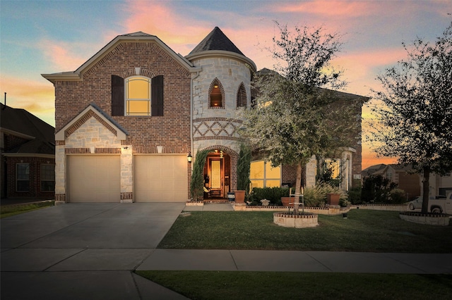 french country home with a garage and a lawn